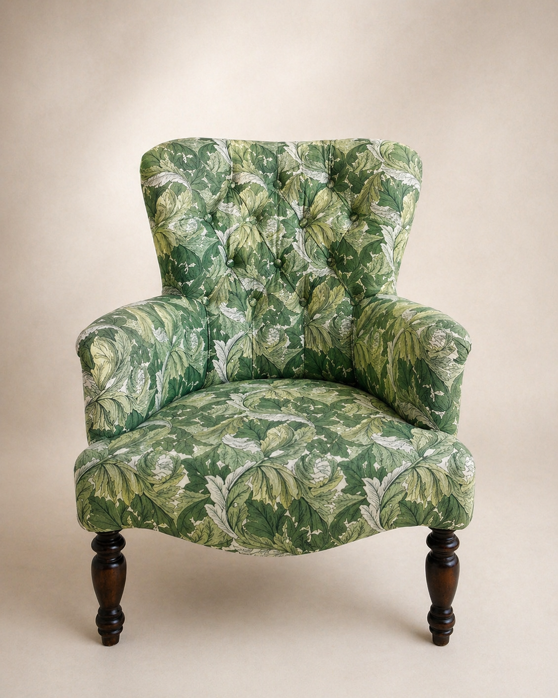 Button-tufted armchair reupholstered in green acanthus leaf print